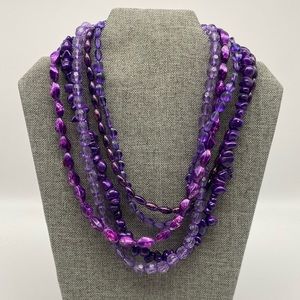 Four strand purple bead necklace
